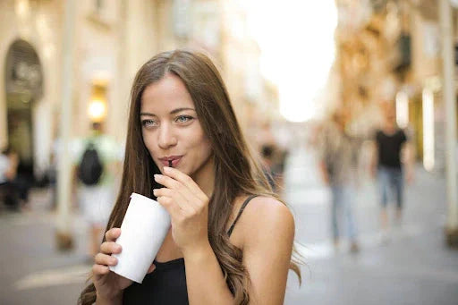 woman drinking kava drink