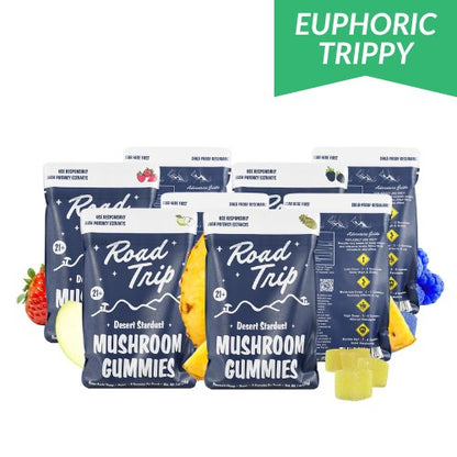 Road Trip Desert Stardust Magic Mushroom Gummies, magic mushroom gummies, mushroom gummies, mushroom extracts, blue bags with white text and mushrooms and mountains with yellow square gummies, pineapple, blue raspberry, green apple, strawberry