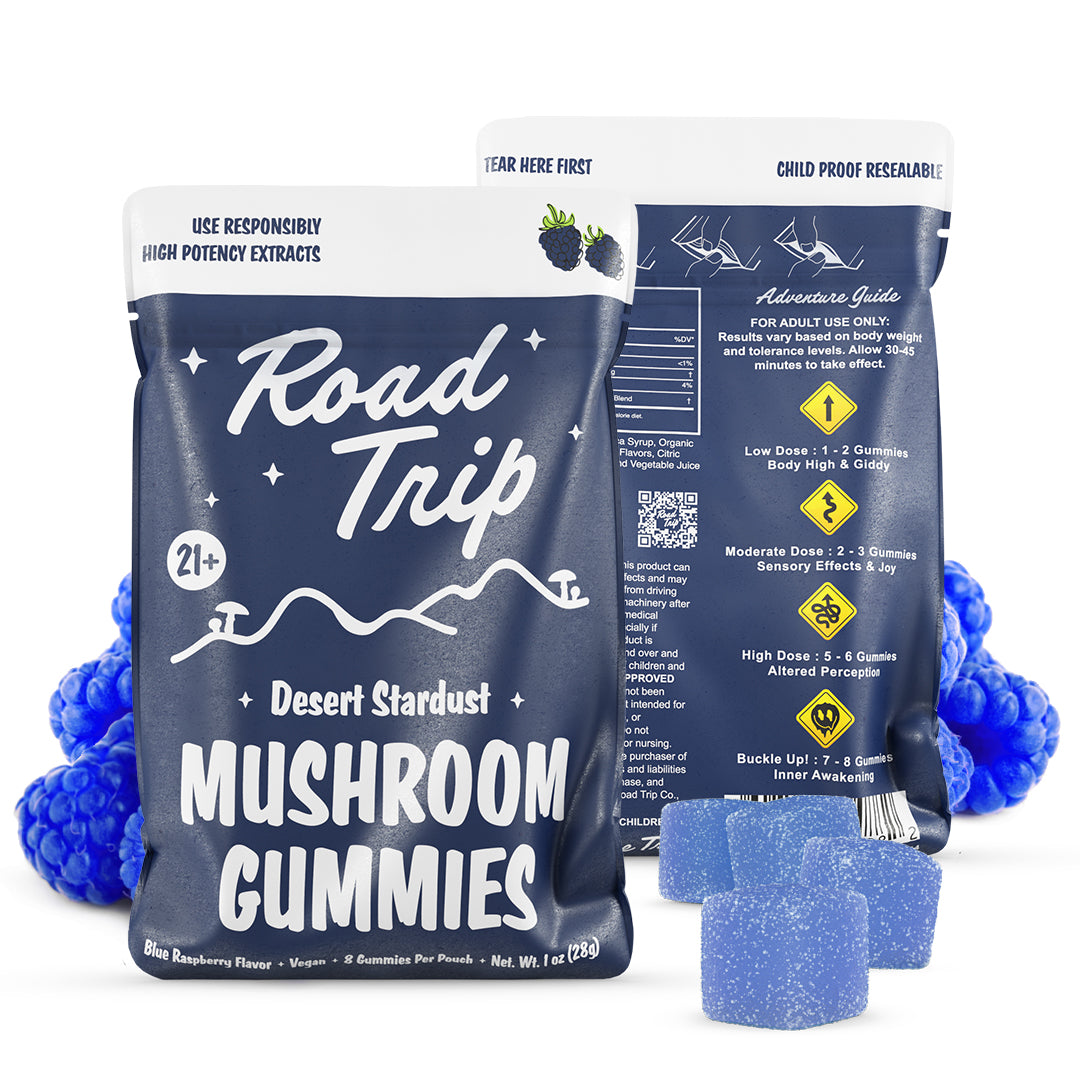 Road Trip Desert Stardust Magic Mushroom Gummies, magic mushroom gummies, mushroom gummies, mushroom extracts, blue bag with white text and mushrooms and mountains with blue raspberries and blue square gummies, blue raspberry