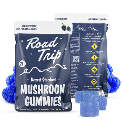 Road Trip Desert Stardust Magic Mushroom Gummies, magic mushroom gummies, mushroom gummies, mushroom extracts, blue bag with white text and mushrooms and mountains with blue raspberries and blue square gummies, blue raspberry